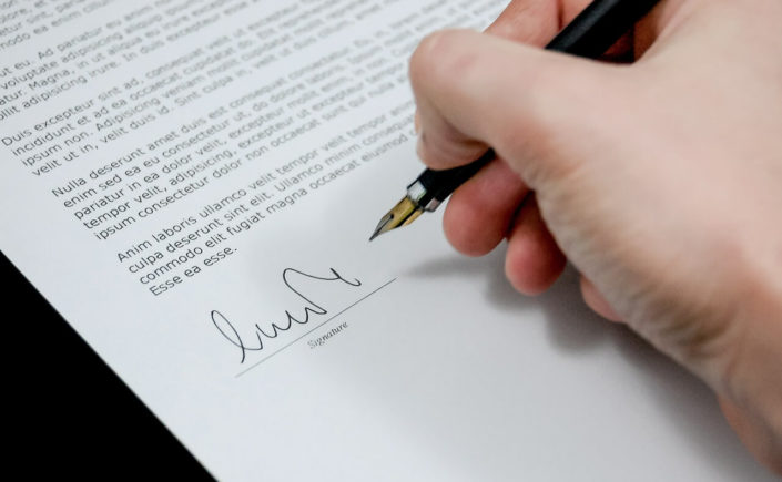 Picture of a customer signing agreement