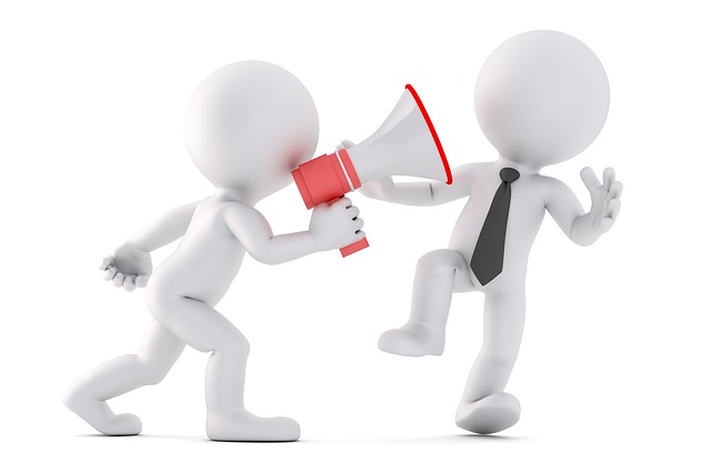 Graphic showing an angry boss shouting through the bullhorn at a staff member