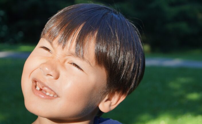 A picture of a young boy with missing front teeth